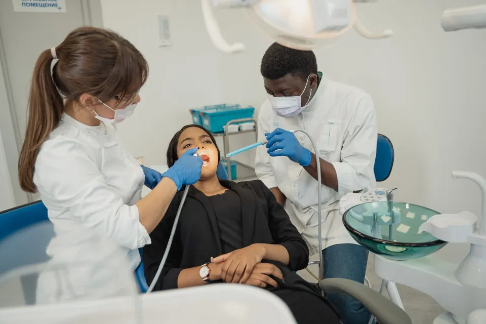A dentist discussing care with a patient